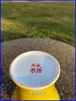A Chinese Yellow Ground Grasshopper Famille Rose Vase Qianlong Mark