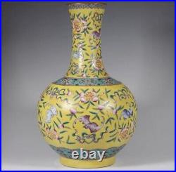 Antique Qianlong mark of the Qing Dynasty, a yellow-ground famille rose vase